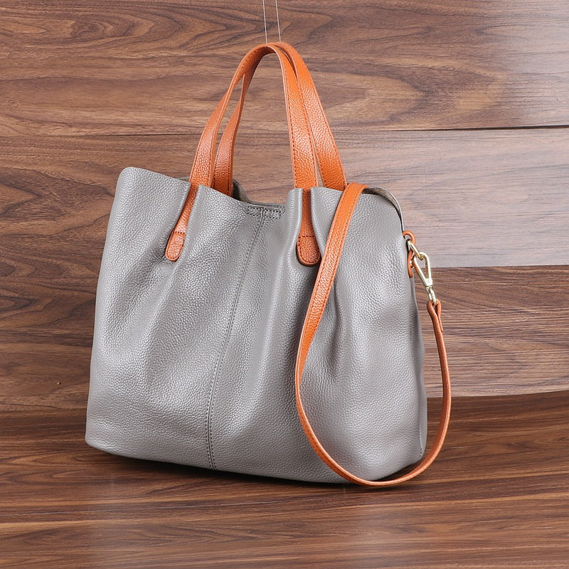 Women's Large Soft Leather Tote Bag made from genuine cowhide leather featuring a bucket shape, zipper closure, spacious interior, and soft shoulder handles by Shardeco